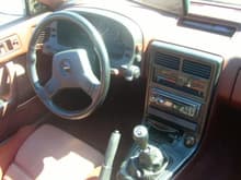 the porno red interior. stereo is gone now and the dash is about to be glassed up.