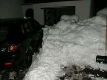 My 3 next to the pile snow in the driveway.