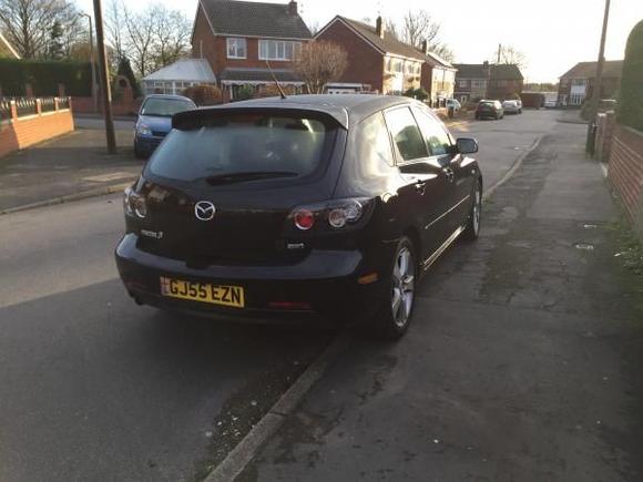 Rear of the vehicle (yes there's a black Autobot badge next to the Sport badge, that was there when I bought it...I swear)
