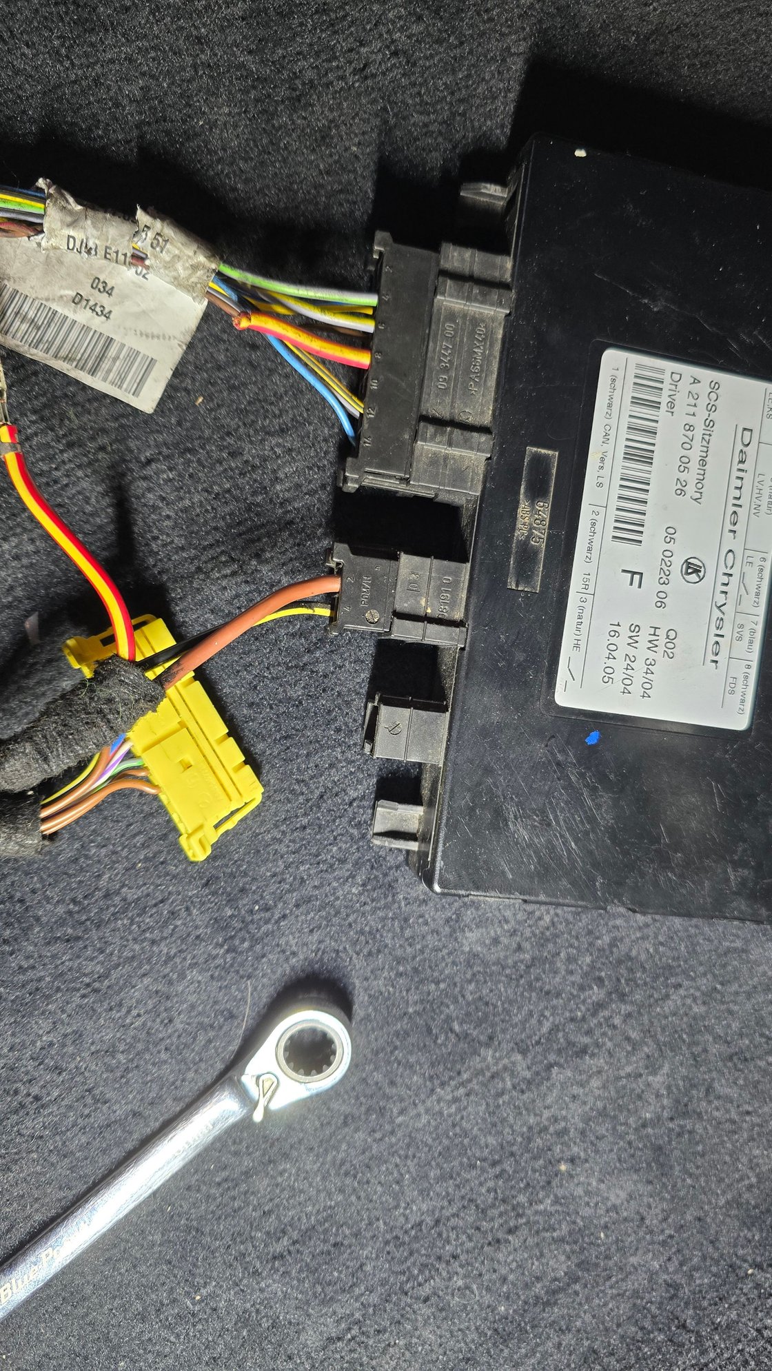 The bigger plug from the seat control module to the plug in the second photo