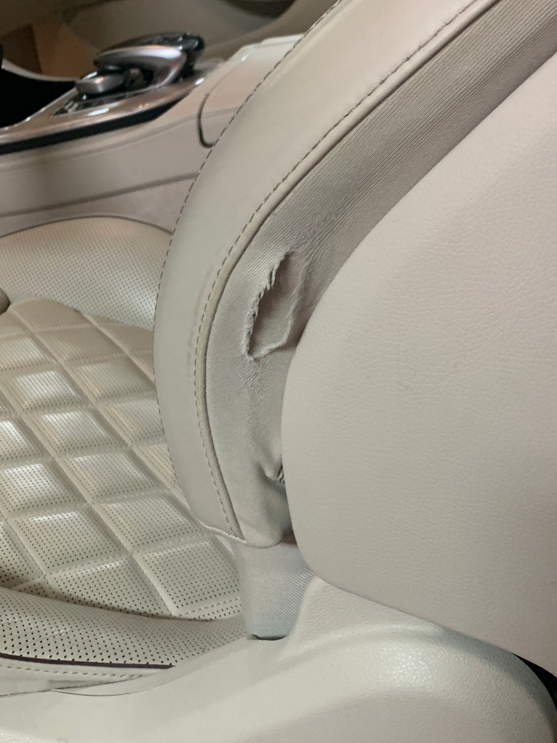 The drivers seat side is exposed, and you can see the interior frame line rubbing through.