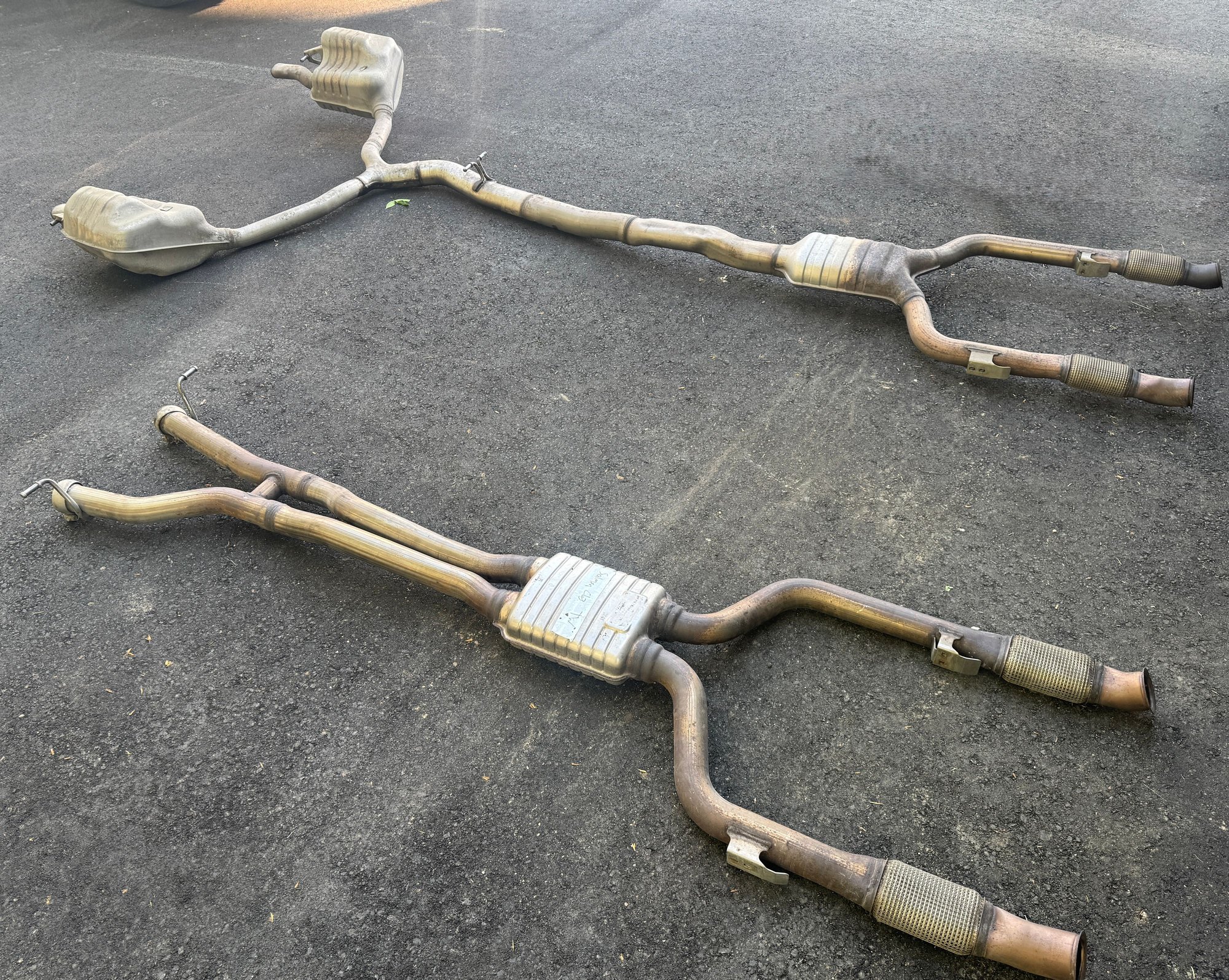 C43 performance midpipe next to stock exhaust (w205 midpipe is slightly shorter than w213)