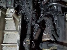 Big blob of black oily stuff near the back of the engine.