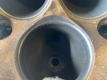 Before exhaust porting, notice the two large and useless “bumps” on each side below the exhaust valve seat... not too mention directly under each valve seat are some pronounced ridges from the factory casting 