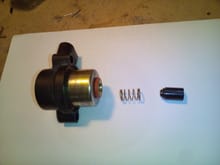This is the order of the parts, the black part is the plunger with a rubber seal on the face of the flat end.
