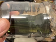 Not entirely clear but it is significantly cleaner than when I started.  It is also closer to the green color of the fluid when it comes out of the tin.