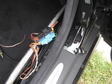 This is where the speaker harness splits from the bose amp.  The light blue harness splits power from the front tweeter and front woofer