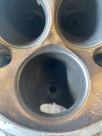 Before exhaust porting, notice the two large and useless “bumps” on each side below the exhaust valve seat... not too mention directly under each valve seat are some pronounced ridges from the factory casting 