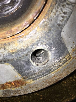 Something inside of the hub. Has been scratched (lighter area) by longer OEM bolt.