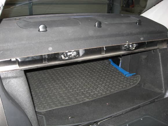 Rear deck cover from car without folding seat option.  Note the exposed black metal where the deck cover ends.