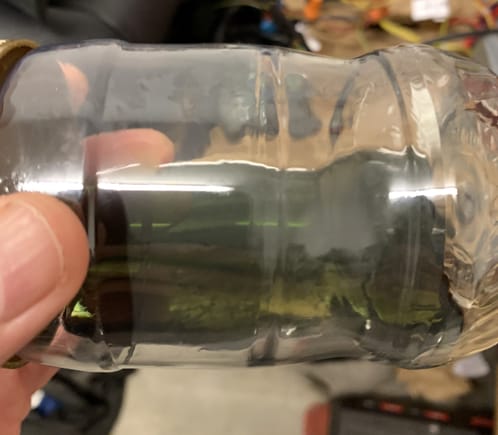 Not entirely clear but it is significantly cleaner than when I started.  It is also closer to the green color of the fluid when it comes out of the tin.