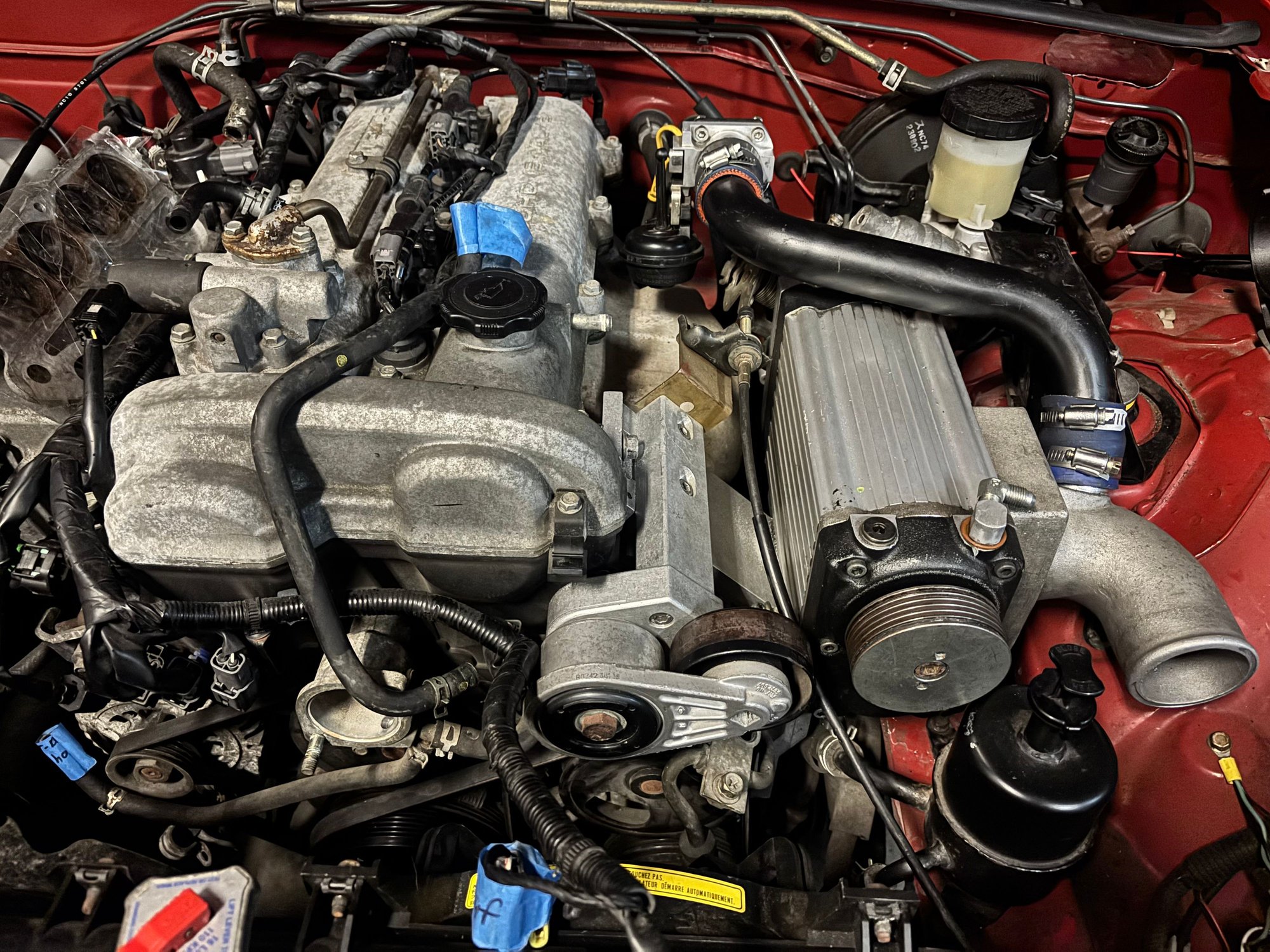 Managed to squeeze it in there, luckily had a picture of the bracket so I just modified the stock one to fit