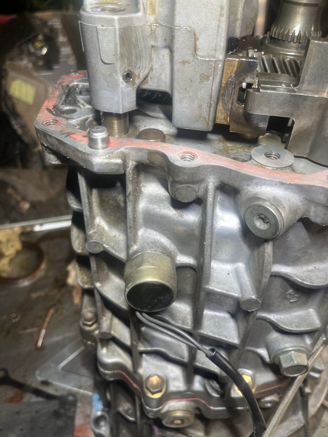 Showing a broader orientation picture. The fluid level, by my reckoning (proof later) should be maybe around the bolt hole to the right of the pin.