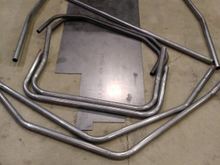 Main hoop, forward hoops, front bars, and some underbody braces bent.