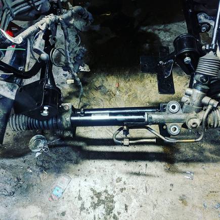 New NB subframe kinda half fitted.  My new one was missing bolts and the new subframe has a larger bolt requirement than the old subframe.  

For somebody who's never really worked on cars before, seeing the steering wheel move the wheels again made me cheese out pretty hard haha.