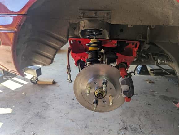 Rear suspension together.  Energy suspension poly bushings all throughout, Rebuilt hubs with ARP extended studs and new bearings, 1.8 brakes now with GLOC R8 pads, 400lb 7" Hypercoil springs on Bilsteins with Torrington bearings and 36mm Bumpstops as well as Goodwin Racing extended tophats.  