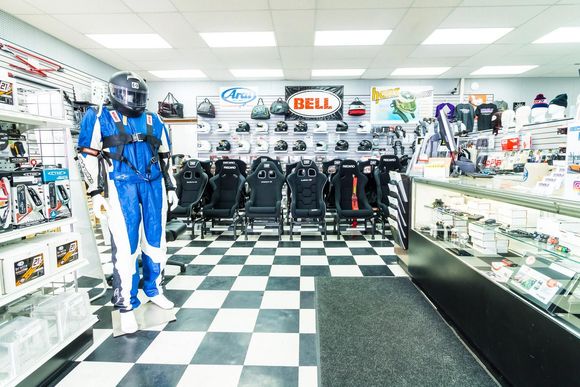 Stable Energies retail store. Directly in front is the racing seats section. To the right is the counter full of racing electronics from AIM & Cartek.