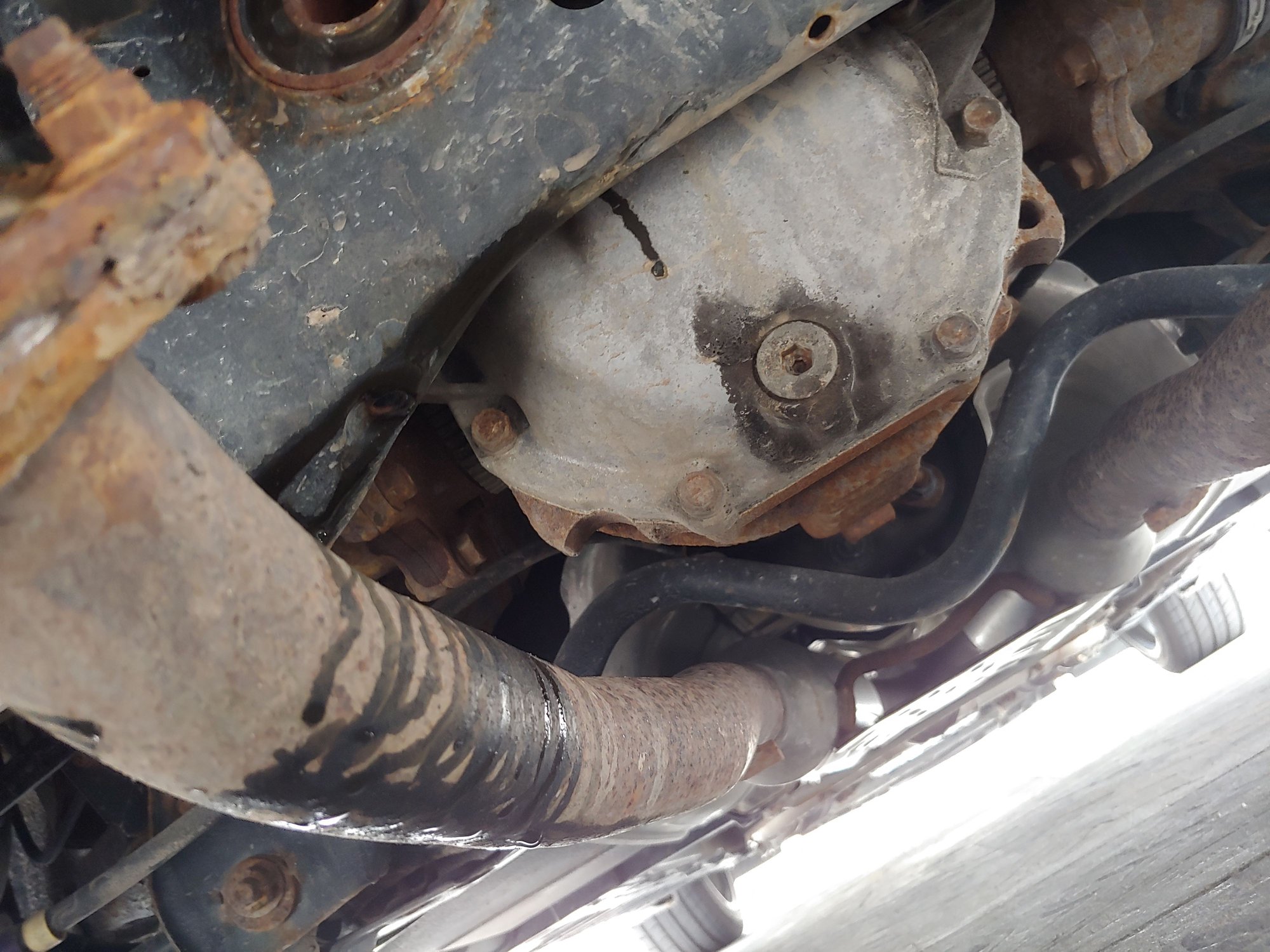 G37 leaking black oil onto exhaust pipes MyG37