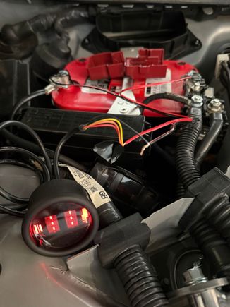 Here is the gauge connected to the battery and tested (red and yellow to + and black to -). The tech at Glowshift recommended as he said often a bad gauge is received and ma y wait till the end to test.