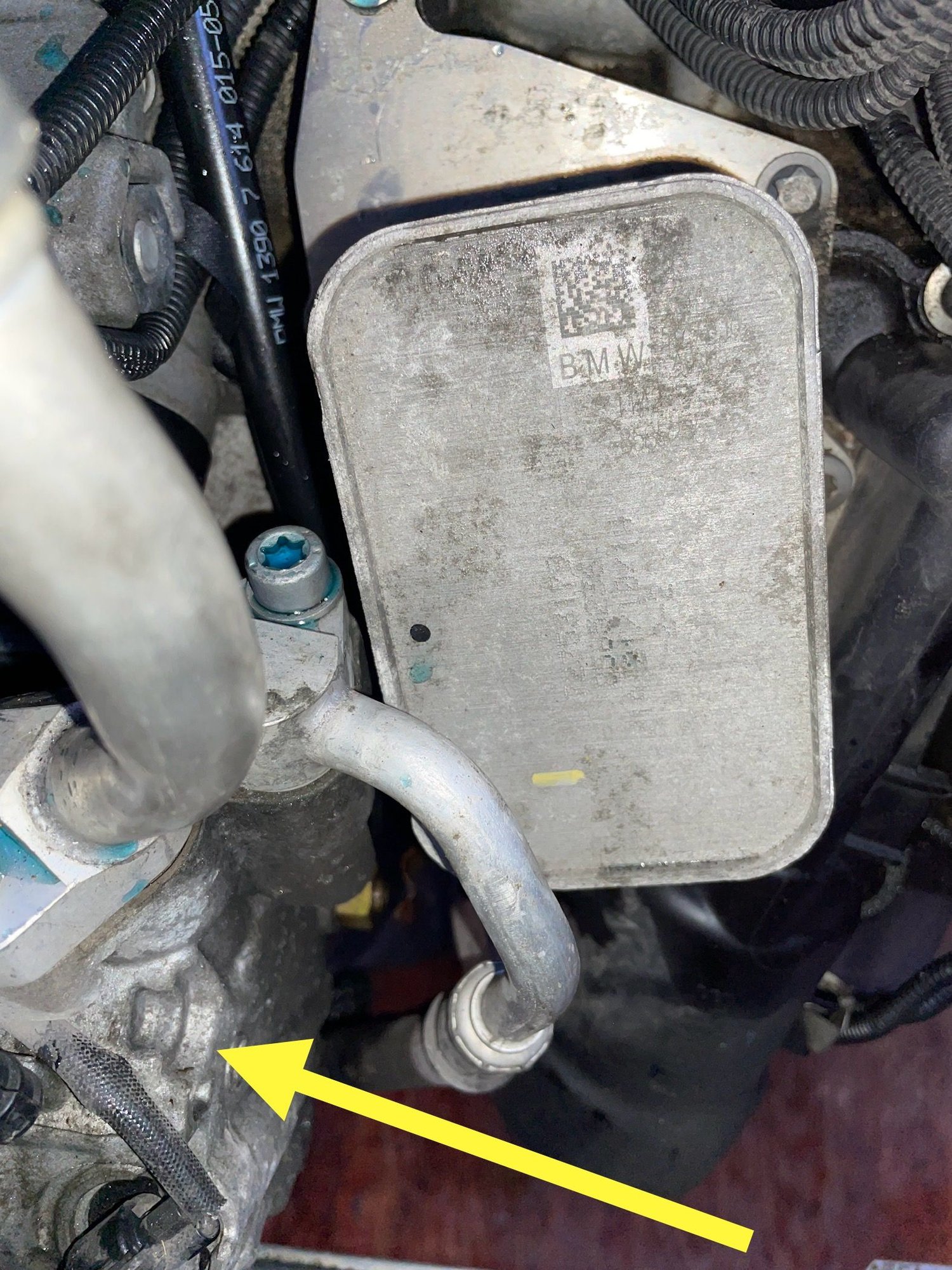Yellow arrow points to AC compressor