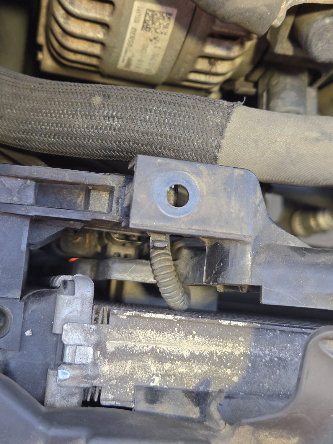 Radiator Environmental Air Catalyst Sensor clipped onto both radiator fan shroud and radiator