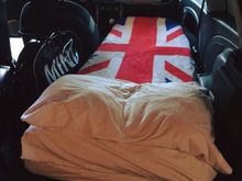 Custom made memory foam 6” thick mattress, full 80” length from glove box to boot(but only 24” wide!  Lol).  Anywhere is an overnight spot!  Lol