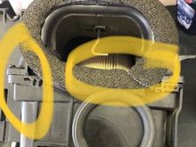 Rear left tab broken secured by small screw.
Opening bottom tab broken compensated by larger foam gasket.