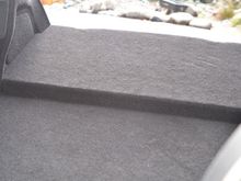 There are a few small indentations from having something heavy on the back board but doesn't effect it's function. 