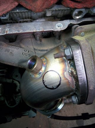 Circle is where the bung should be to fit out of the factory heatshield. And clear the AEM heatshiled as well.