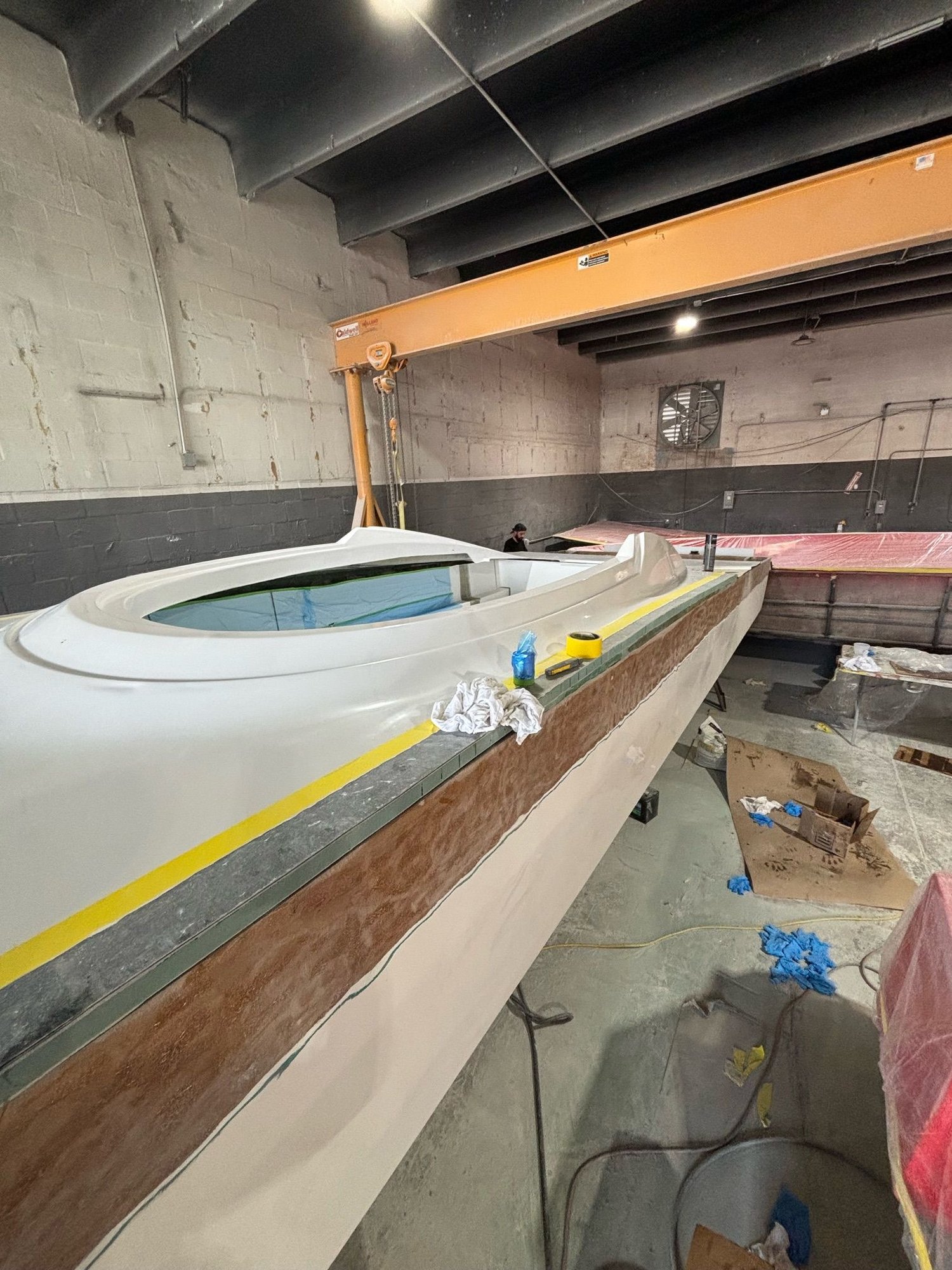 The outside edge of the hull will be routered to have a radius and glass lamination added before final finish work.