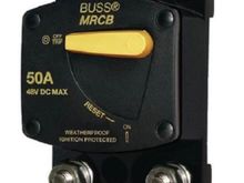 You are looking for this or similar. Maybe looks like it has a push button in addition to the lever disconnect.
Turning this off will eliminate all of the parasitic drain problems you are having.