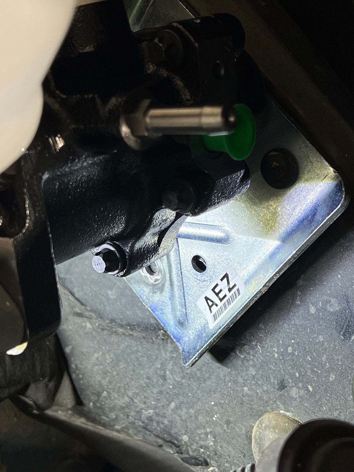 Down by the sticker you can see the hole that doesn�t line up. I will either drill the hole in the firewall or make a different hole in the mounting plate. Leaning towards making different hole in the mounting plate. 