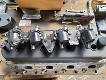 Coils getting mounted and decidinv where to install the fittings  for the catch can.