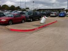 Truck in school parkin lot. There was a black bird on top, pity iPhone camera couldnt get a closer zoom