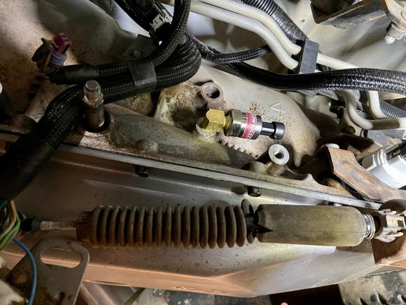 Trans pressure sensor positioned to fit behind PRNDL.