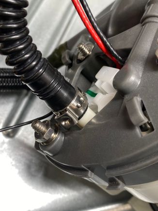 Fuel tube on pump outlet and clamp installed.