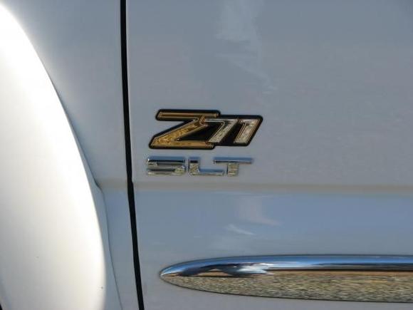 Tahoe Z71 badge and 2010 Sierra SLT emblem. I removed the black rubber SLT emblem from behind the rear windows.