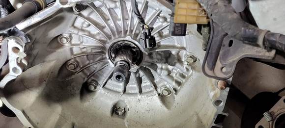 The seal is held in with a c clip.  That was frustrating until we discovered it.