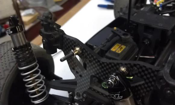Shaved stock shock mounts to space shocks away from tower and upper arms.