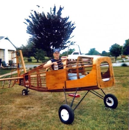 Setting in my yard when I was 17 in a home built Bobcat ultralight I was working on around 1998