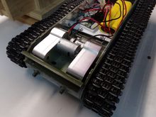 Upclose of the gearboxes mounted.  It's a very tight fit.  The screws holding them in come in from underneath.  Had to drill some holes as the Taigen suspension interfered with one of the mounting holes.  Luckily they have multiple tapped hole options on the gearboxes.