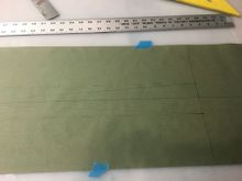 Rudder horns to rear.  Solid line is crossed cables dashed line is straight cables