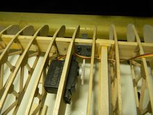 Servo must be flipped end for end to make room for the flying wire mount. 