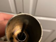 Ok here’s a photo.  Maybe the piece broke off and it’s not a two piece. . . . 
How would this affect the running now that the other piece is gone.  ?
Maybe the exhaust will escape better??
