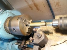 Into the lathe to cut the 4mm hole in the middle.