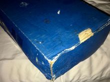 And this is what you want to know about, this end saw something wet, and cardboard doesn't keep its shape when wet.  Contents are fine.