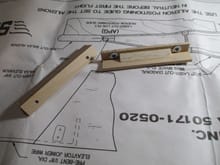 These are two Basswood brackets that will hold the aileron servo cover on the wing.  Each bracket is made from 1/2" x 1/8" lengths epoxied together to form a simple 90 degree angle.  I further reinforced it by gluing in a short piece of balsa tri-stock for good measure.  