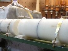 Upclose of the reworked fuel tank mounts that move them to the outside of the skirts.  I reprofiled them to hang over.  It's not perfect, but close to how the real tanks mount.  Used a steel nut to thread onto the brass rod soldered to the strap.