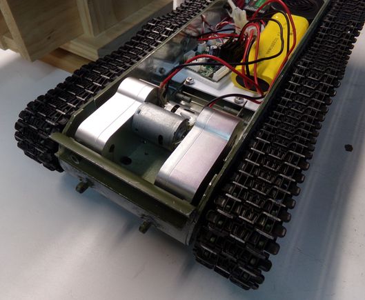 Upclose of the gearboxes mounted.  It's a very tight fit.  The screws holding them in come in from underneath.  Had to drill some holes as the Taigen suspension interfered with one of the mounting holes.  Luckily they have multiple tapped hole options on the gearboxes.