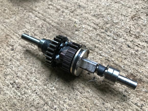 This is what’s bad in my mgt 8.0. I’m pretty sure I need this whole shaft replaced and the gears on it. Those are welds the kid before me did with the stripped gear. And I’m not sure what the black plastic spacers are they aren’t uniform so he may have thrown those on there for some reason. 